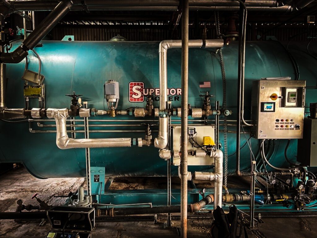 Industrial equipment attached on a blue tank